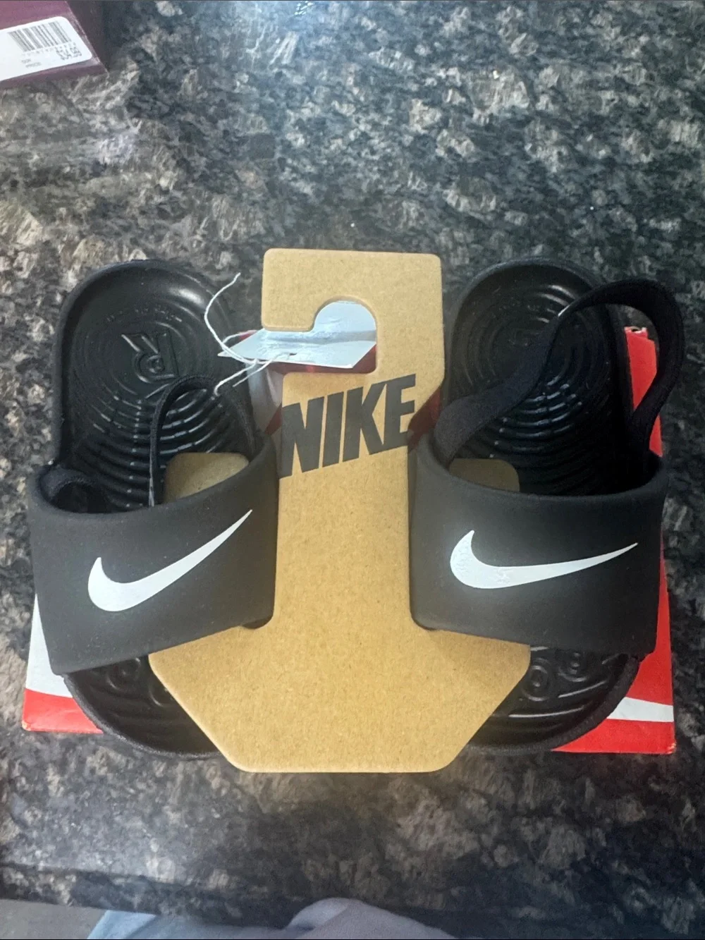 Nike Black Slide Sandals with White Swoosh Accent